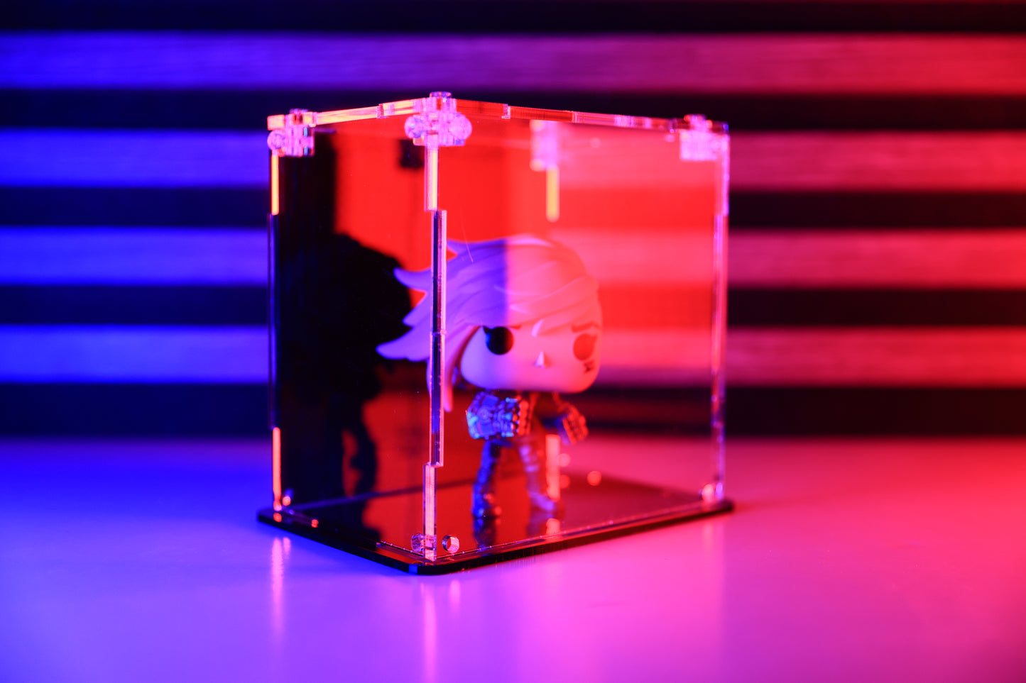 Funko Pop! vinyl figure in a clear acrylic display case with a coloured back.